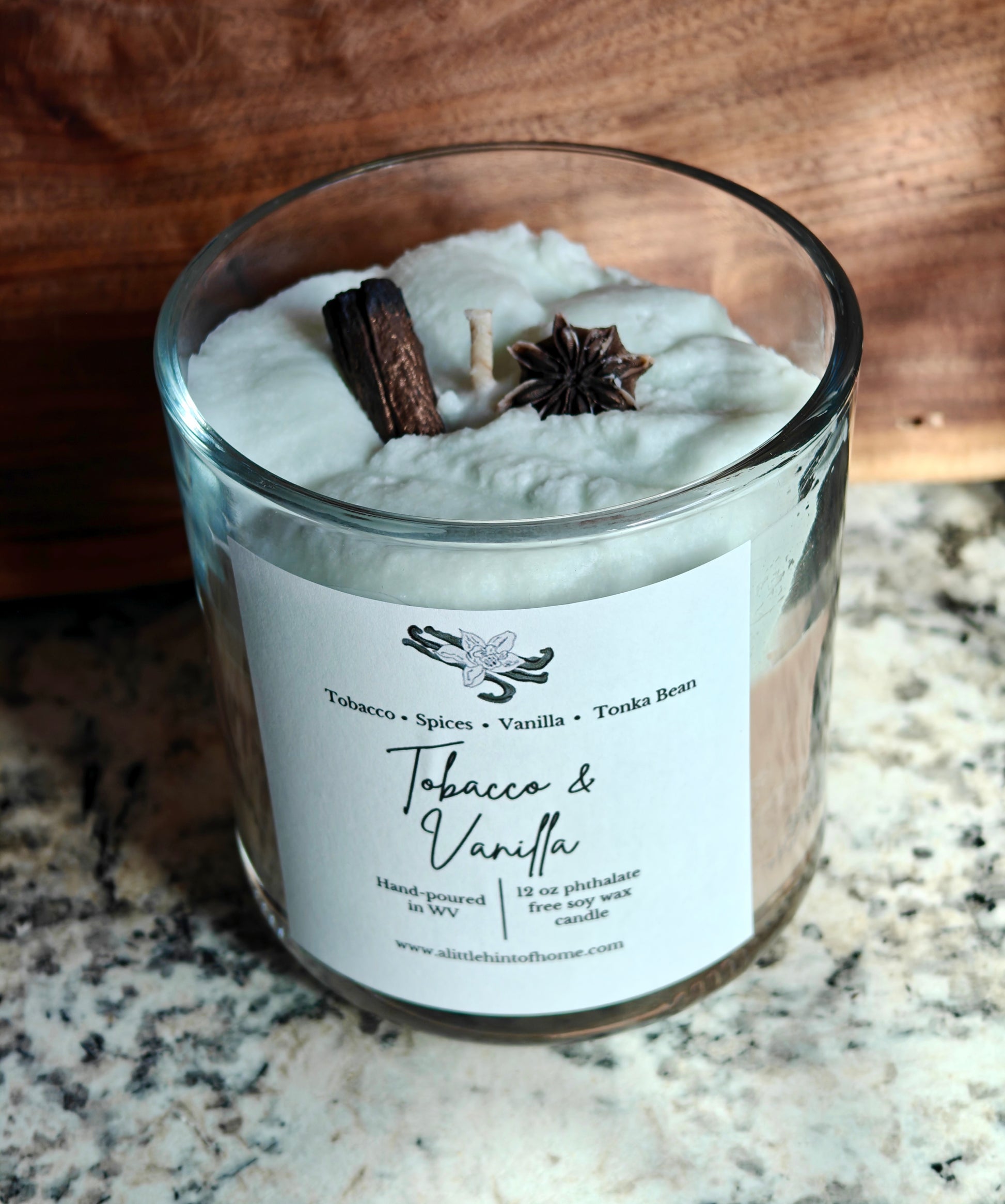 whipped soy candle with wax embeds on top with label stating tobacco and vanilla