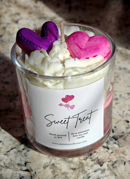 Candle in a glass jar with heart-shaped wax melts on top, labeled 'Sweet Treat'.