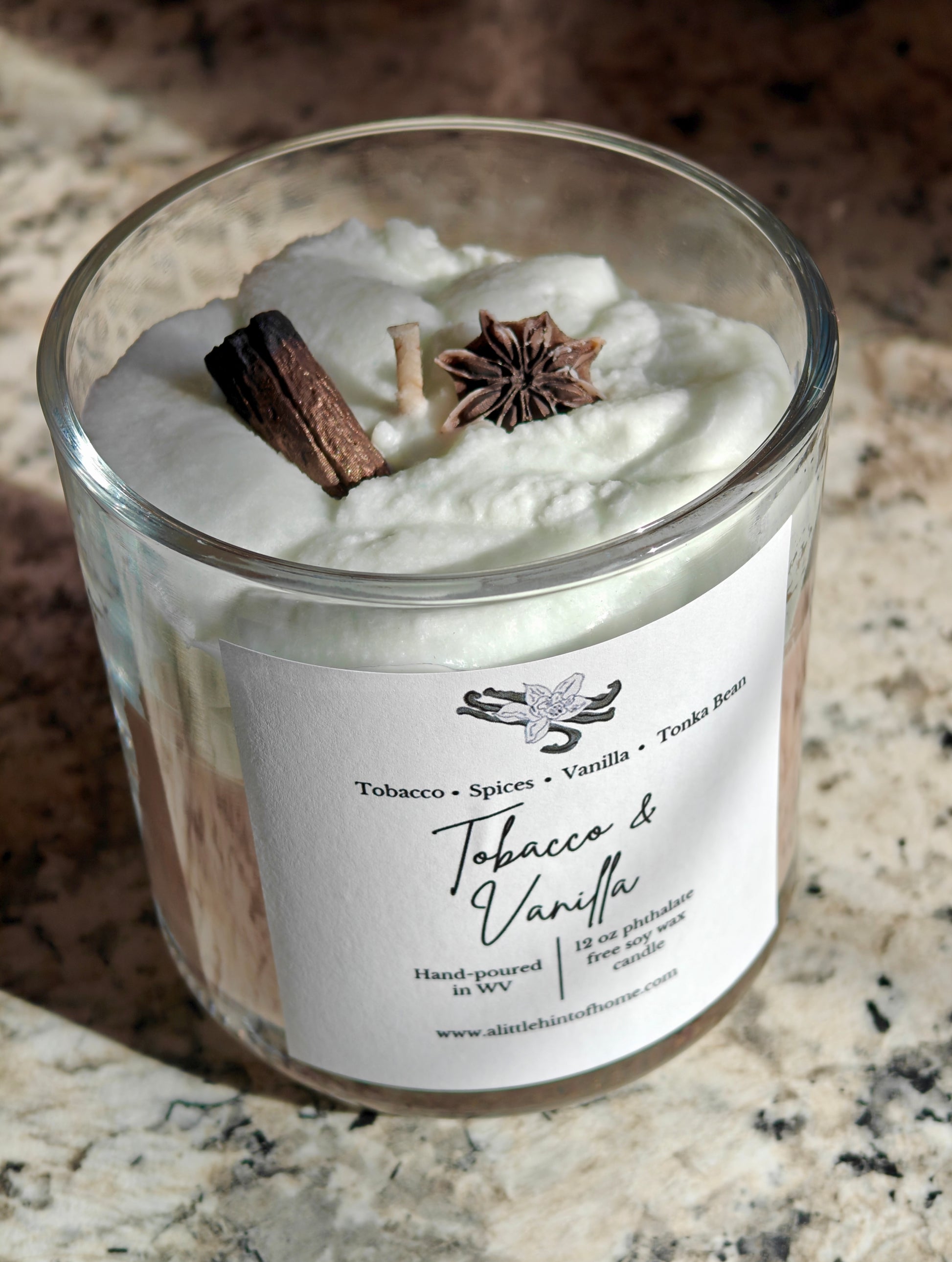 whipped soy candle with wax embeds on top with label stating tobacco and vanilla