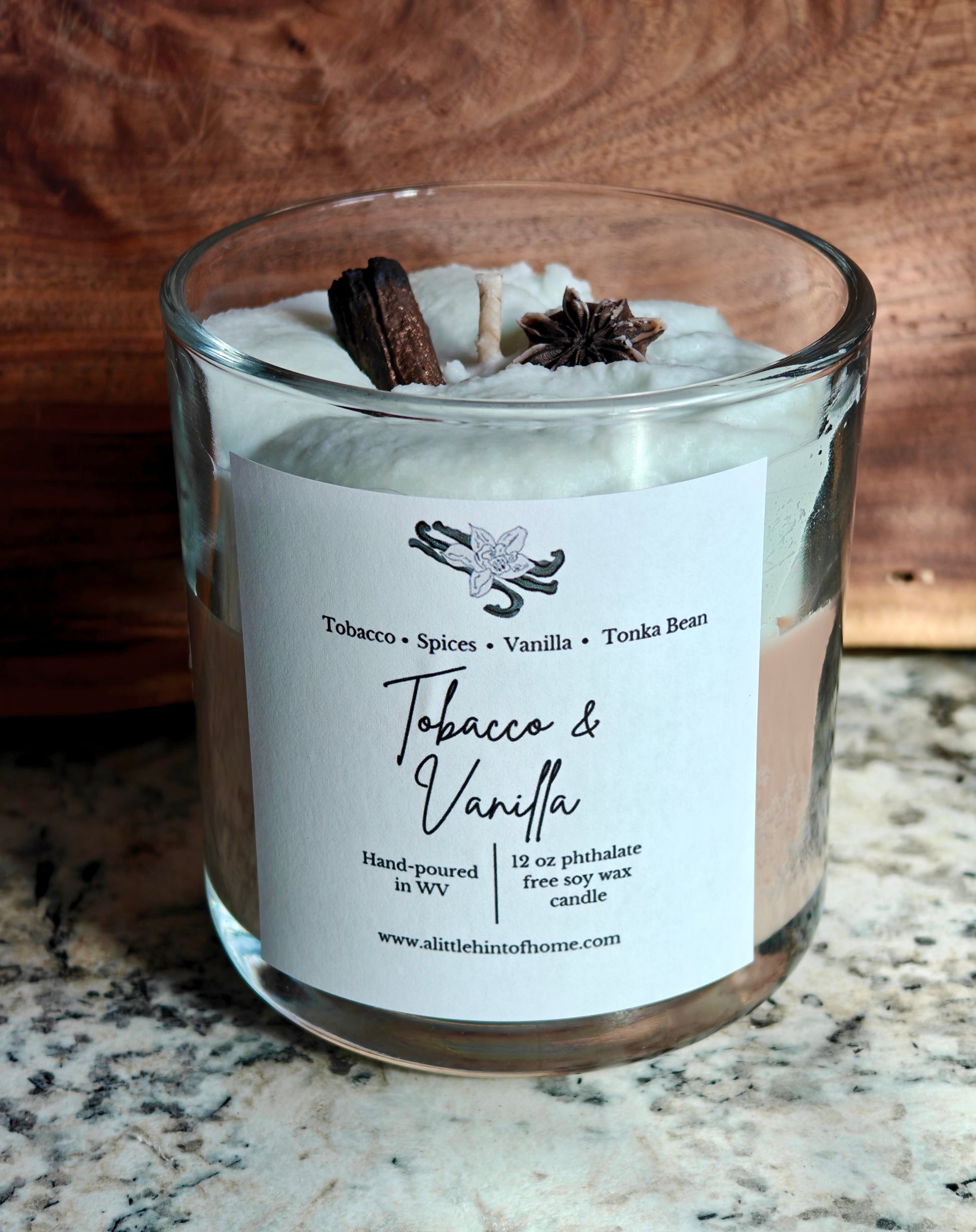 whipped soy candle with wax embeds on top with label stating tobacco and vanilla