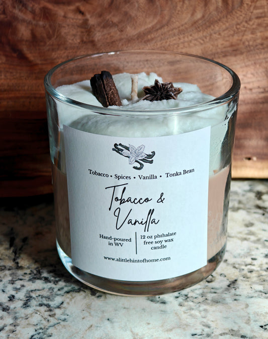 whipped soy candle with wax embeds on top with label stating tobacco and vanilla